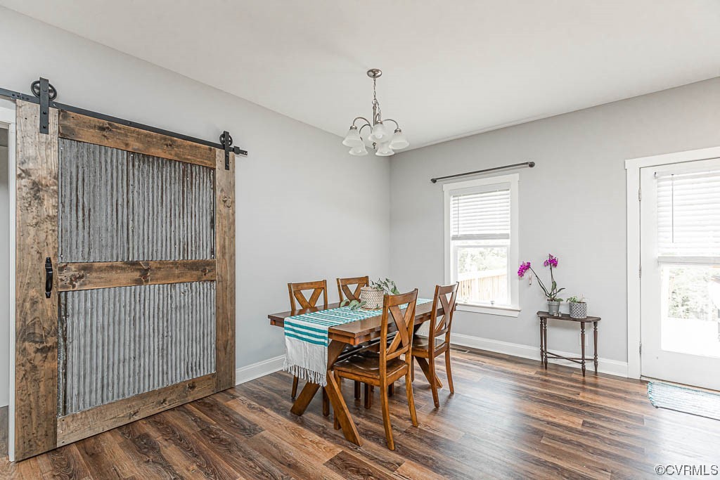 4111 Cedar Plains Road Sandy Hook, VA 23153 - Photo 9 of 28 a view of a dining room with furniture and wooden floor