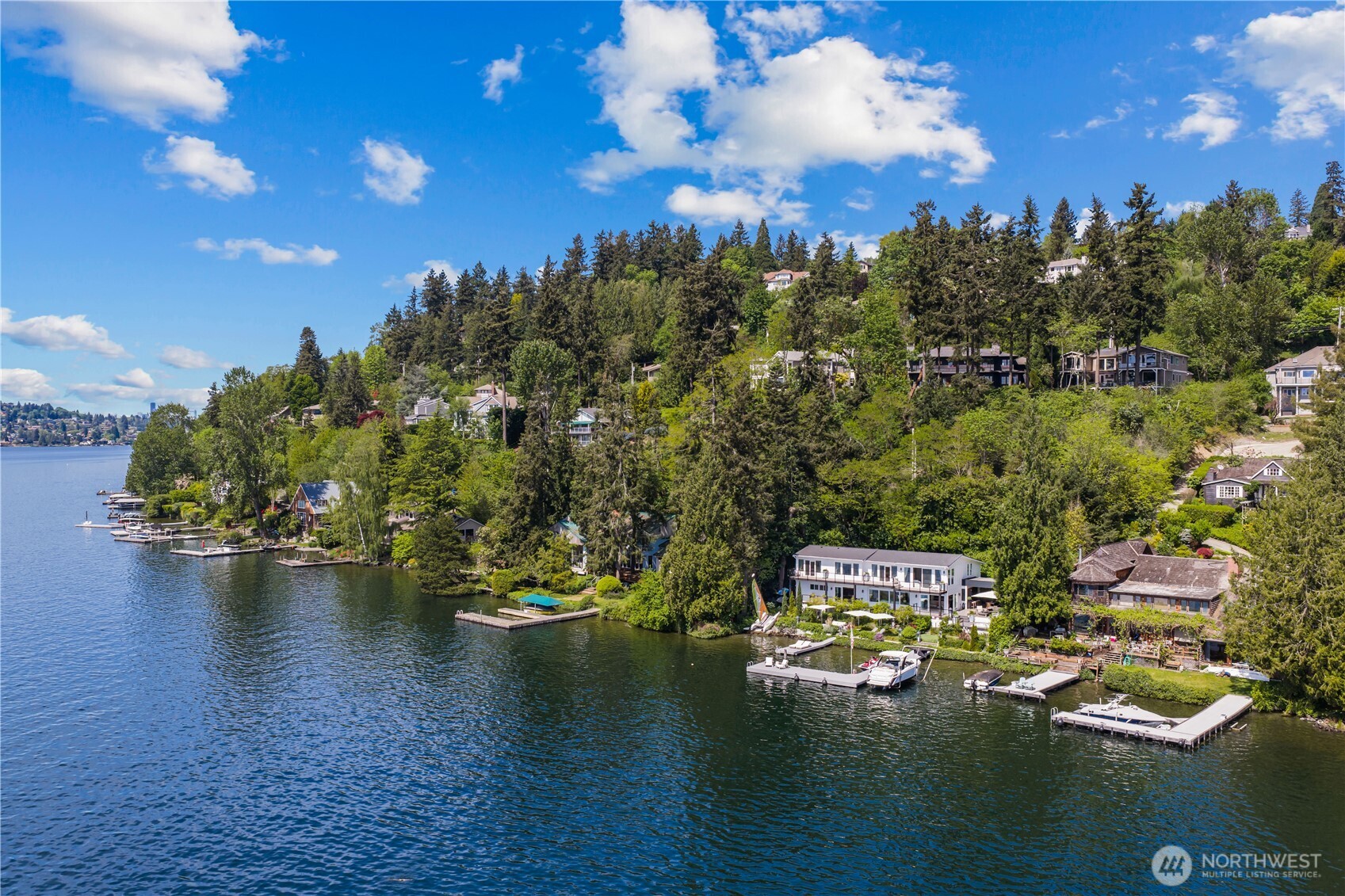 8097 West Mercer Way Mercer Island, WA 98040 - Photo 39 of 40 a view of a lake with lawn chairs