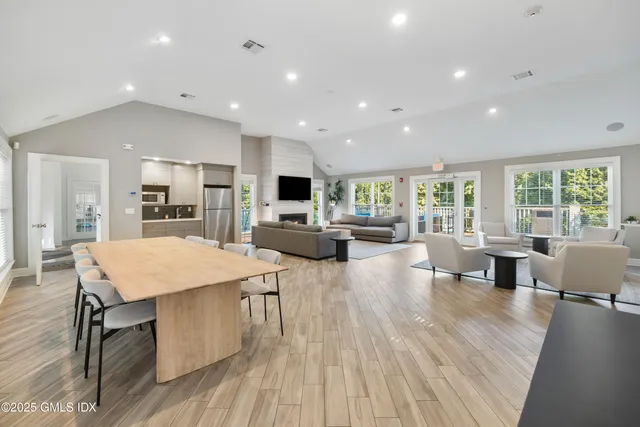a large kitchen with a table and chairs