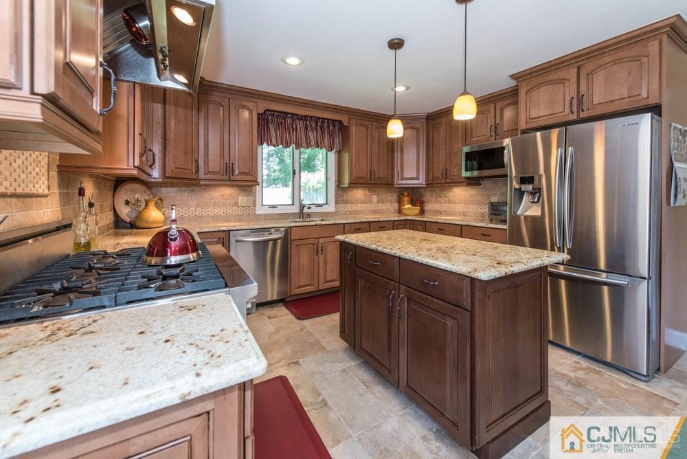 205 Raymond Road Princeton, NJ 08540 - Photo 14 of 25 a kitchen with stainless steel appliances granite countertop a sink stove and refrigerator