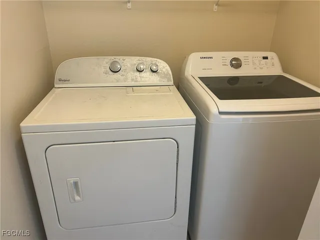 a utility room with dryer and washer