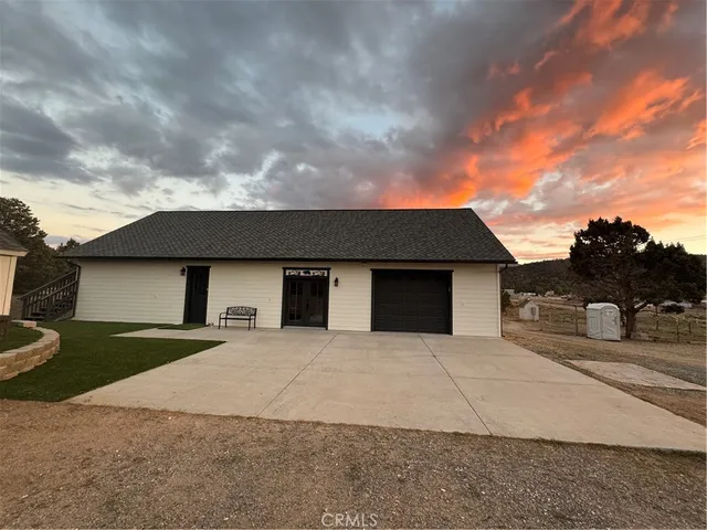 a front view of a house with yard