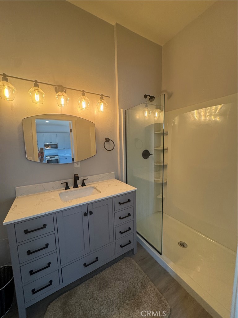 46685 Benito Wilson Road, Unit ADU Big Bear City, CA 92314 - Photo 15 of 19 a bathroom with a double vanity sink mirror and shower
