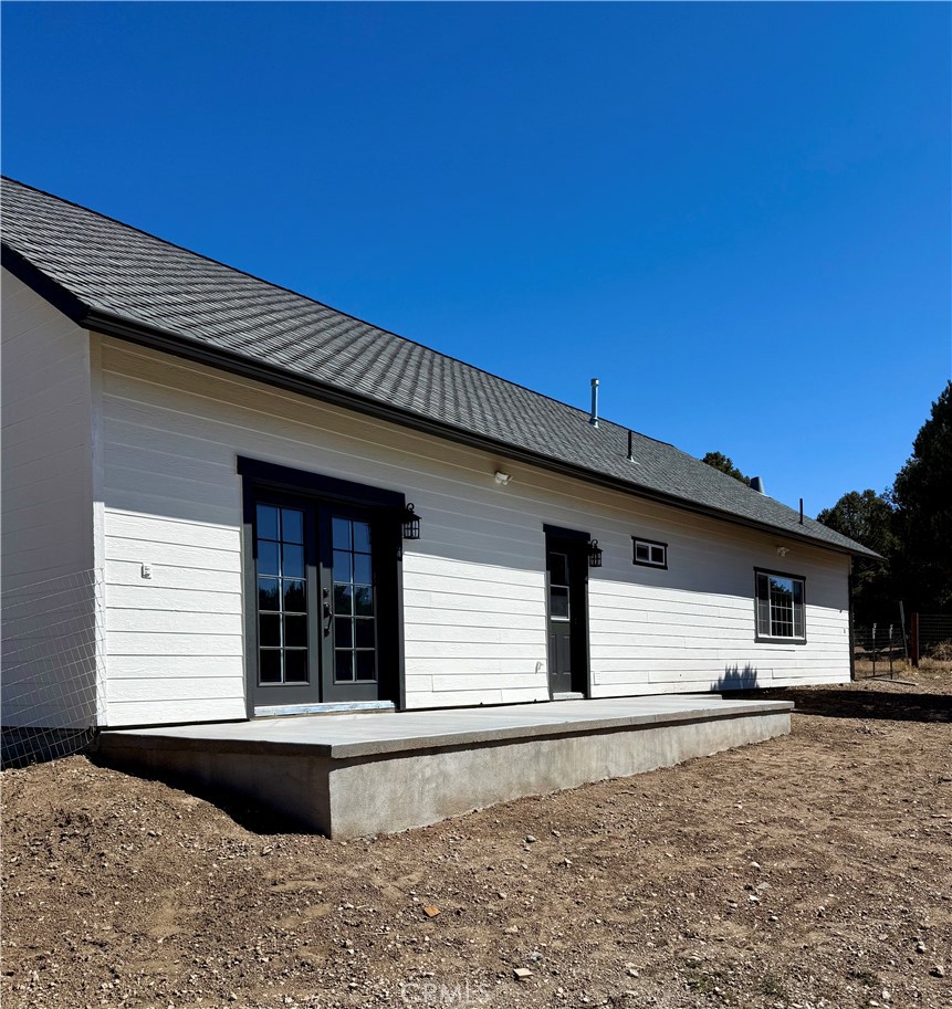 46685 Benito Wilson Road, Unit ADU Big Bear City, CA 92314 - Photo 18 of 19 a front view of a house with a yard