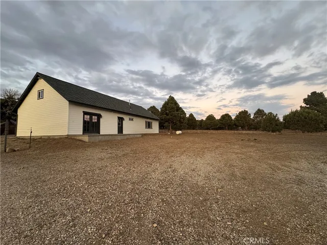 a view of house with yard and entertaining space