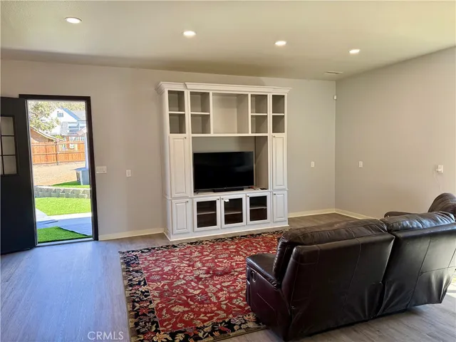 a living room with furniture window and flat screen tv