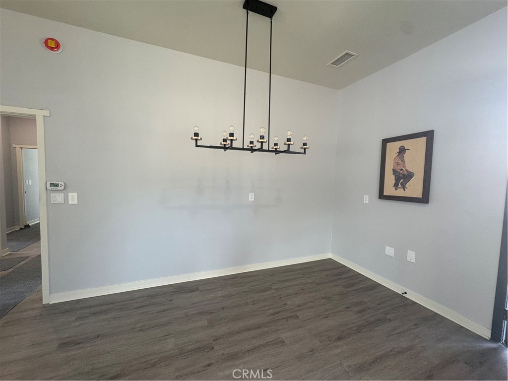 46685 Benito Wilson Road, Unit ADU Big Bear City, CA 92314 - Photo 8 of 19 a view of a room with wooden floor and ceiling fan