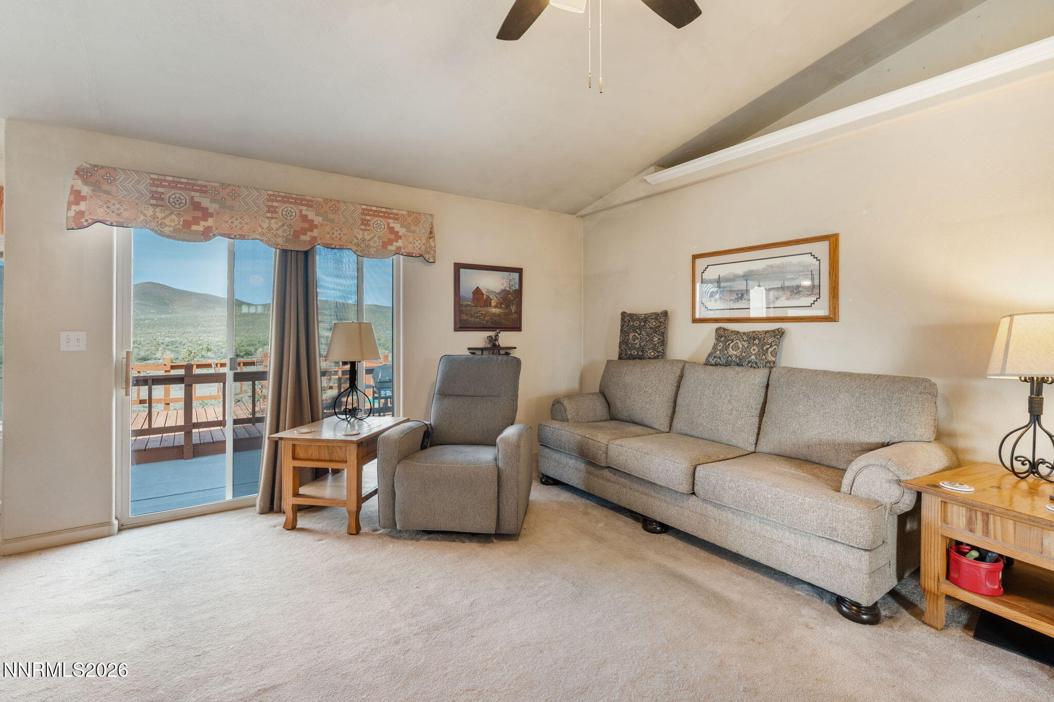 219 David Avenue Stagecoach, NV 89429 - Photo 10 of 40 a living room with furniture and a floor to ceiling window