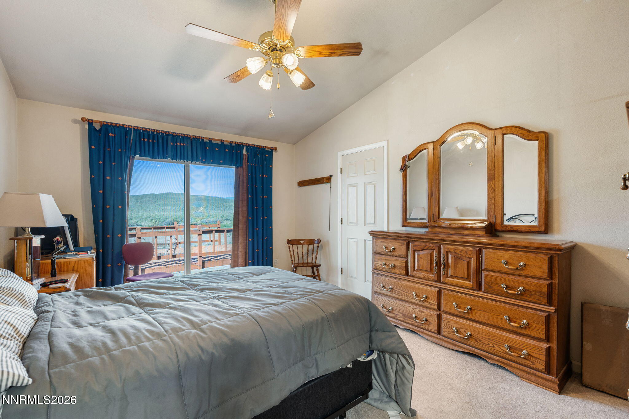 219 David Avenue Stagecoach, NV 89429 - Photo 15 of 40 a bedroom with a bed and a dresser