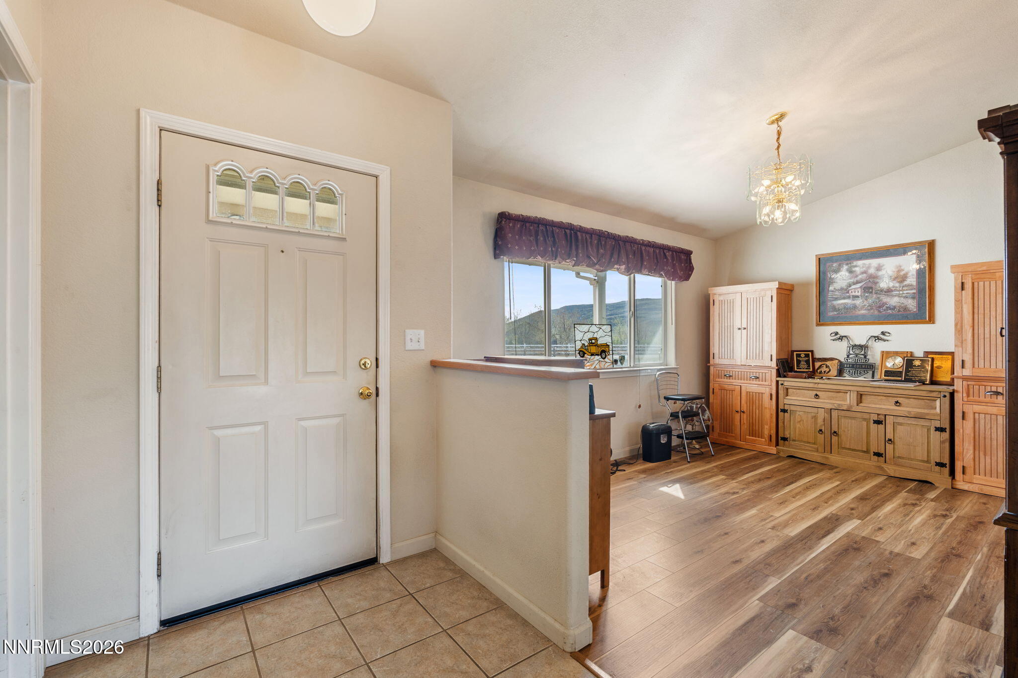 219 David Avenue Stagecoach, NV 89429 - Photo 3 of 40 a kitchen with stainless steel appliances a refrigerator a sink dishwasher and white cabinets with wooden floor