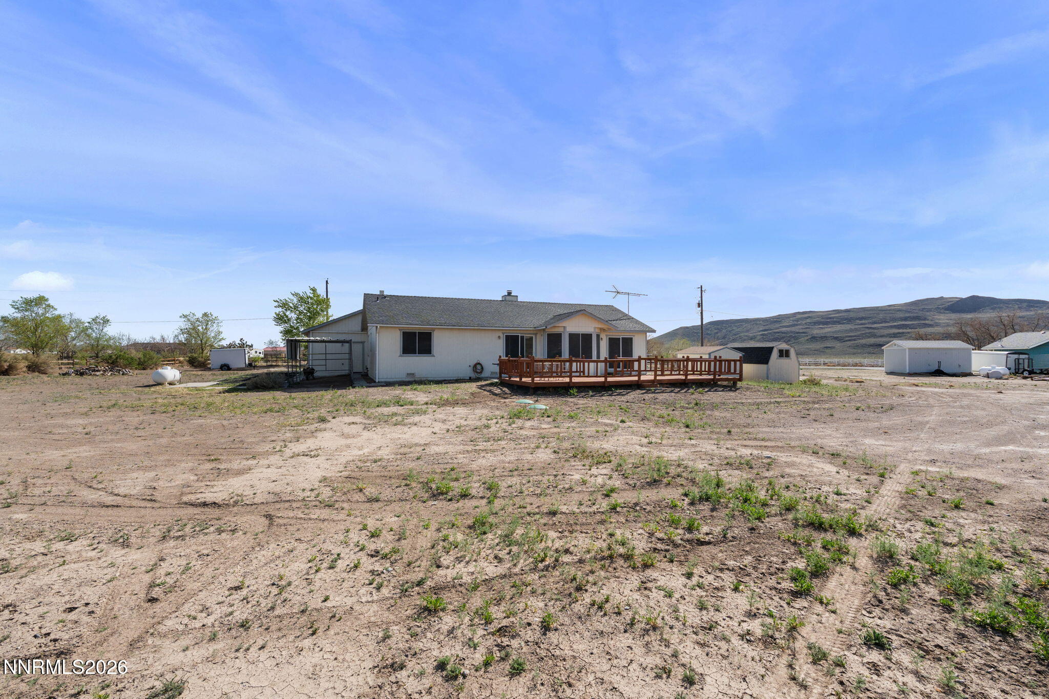219 David Avenue Stagecoach, NV 89429 - Photo 36 of 40 a view of a dry yard with wooden fence