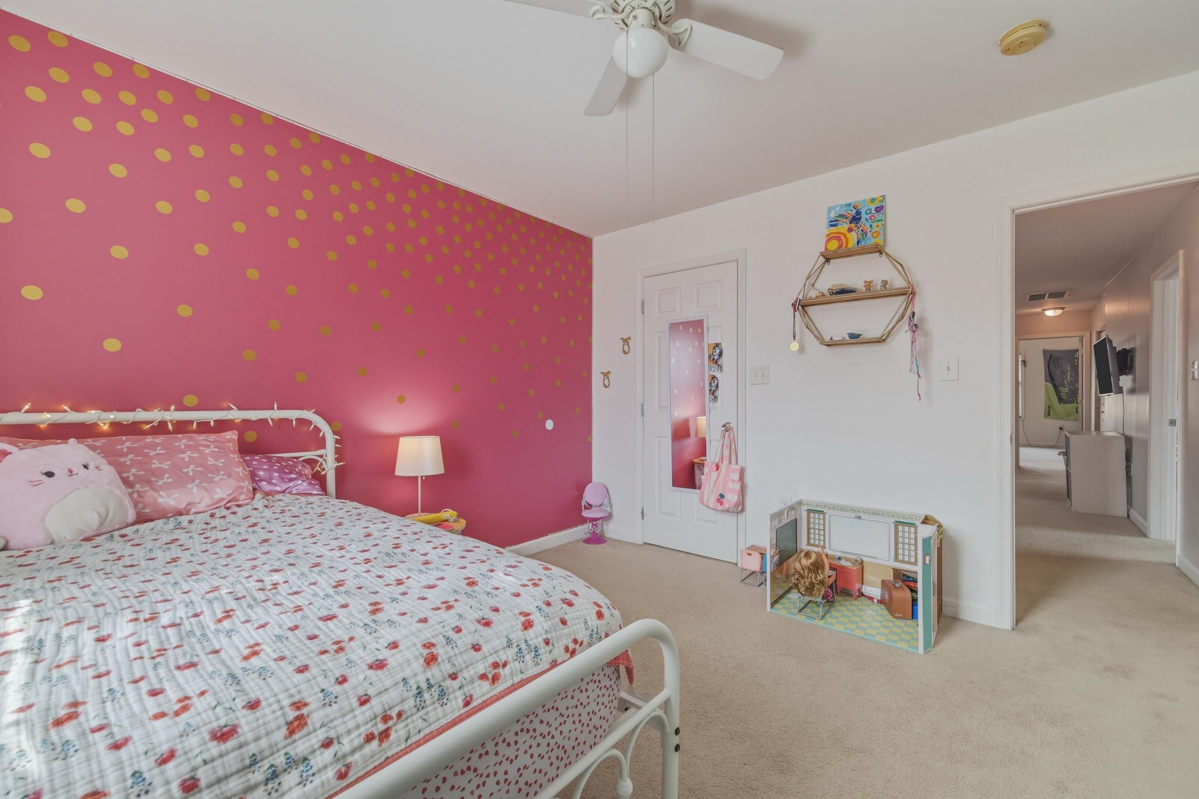 257 Hunter Road Maurertown, VA 22644 - Photo 34 of 61 a bedroom with a bed and a chandelier