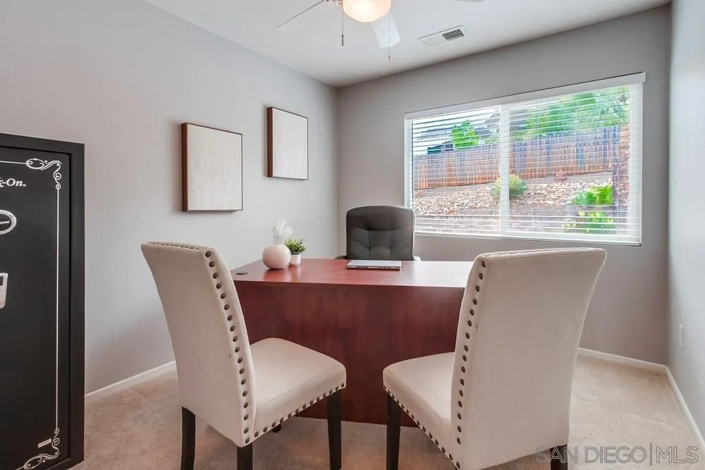 14230 Match Point Drive Poway, CA 92064 - Photo 23 of 70 a view of a dining room with furniture and a window