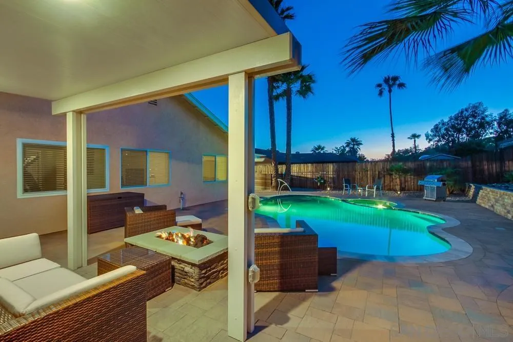 14230 Match Point Drive Poway, CA 92064 - Photo 41 of 70 a backyard of a house with barbeque oven table and chairs