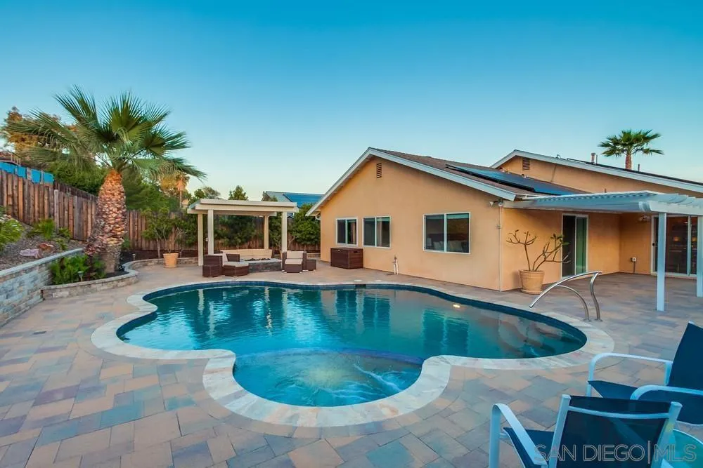 14230 Match Point Drive Poway, CA 92064 - Photo 50 of 70 a front view of house with yard swimming pool and seating space