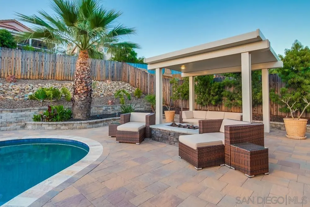 14230 Match Point Drive Poway, CA 92064 - Photo 60 of 70 a view of swimming pool with couches and potted plants