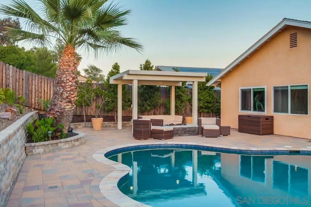 14230 Match Point Drive Poway, CA 92064 - Photo 64 of 70 a view of a house with backyard sitting area and swimming pool