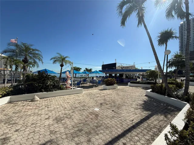 a view of a swimming pool with outdoor seating