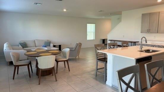 4520 Ranunculus Street Haines City, FL 33844 - Photo 7 of 19 a view of a dining room with furniture and a potted plant