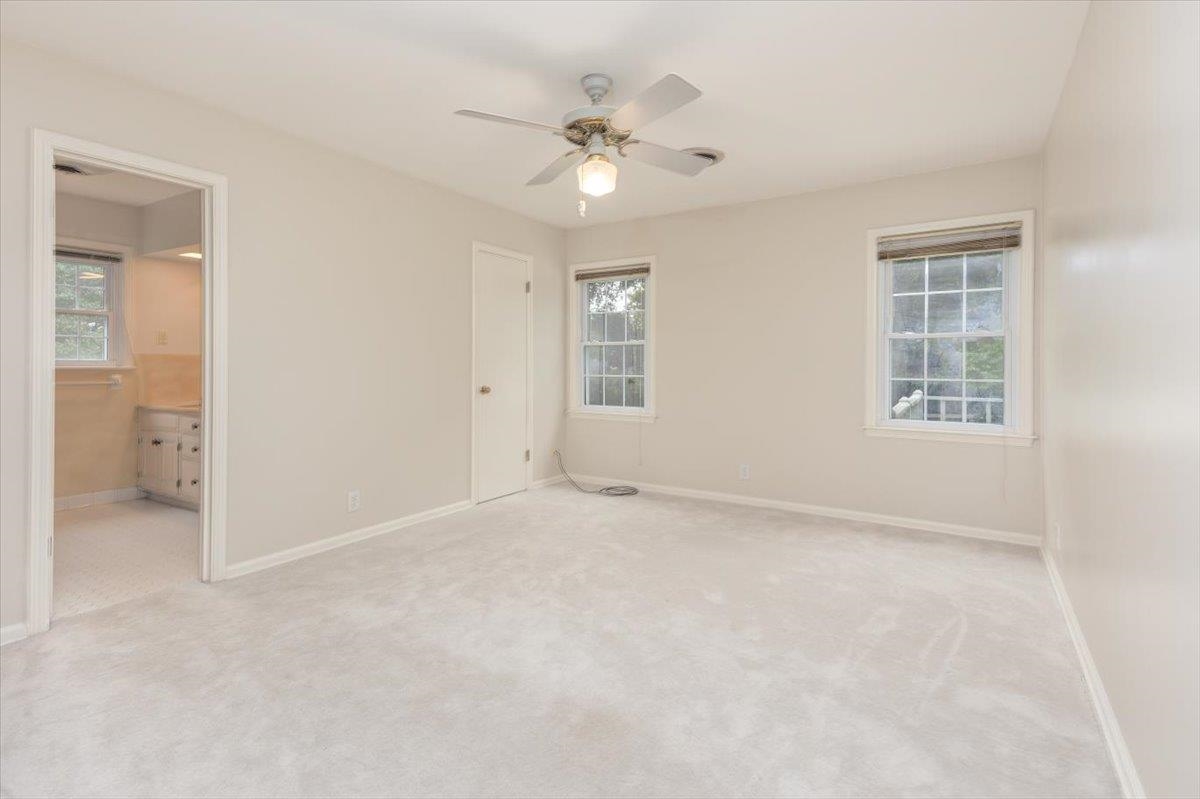 670 Peterson Lake Road Collierville, TN 38017 - Photo 23 of 37 Carpeted room with neutral wall tones and a ceiling fan with integrated lighting