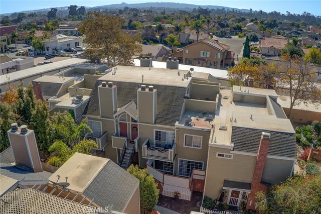 a view of a livingroom with wooden floor and a flat screen tv