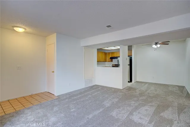 an entryway and a fan in a room