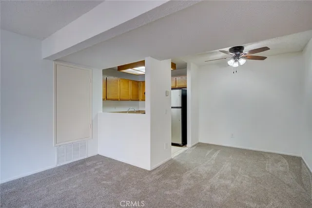 a white refrigerator freezer sitting inside of a kitchen
