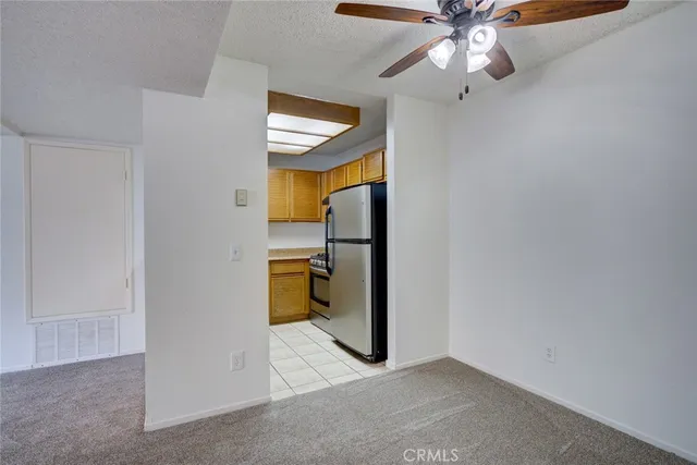 a close view of a stove a microwave and a sink in the kitchen