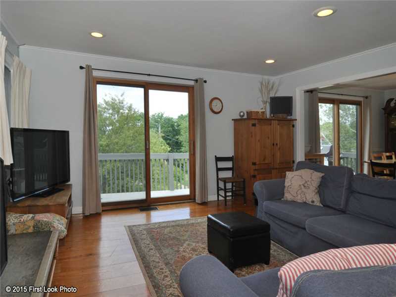50 Sloop Street Jamestown, RI 02835 - Photo 5 of 25 Living Room. Sliders to the deck and winter water views