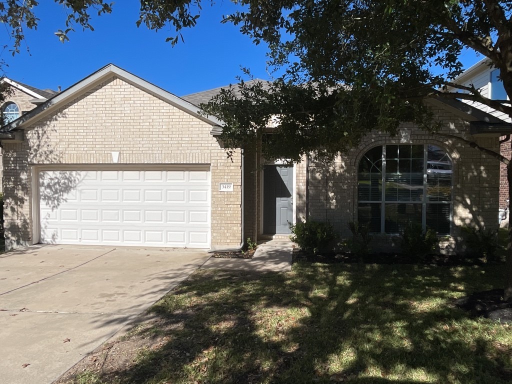 3419 Shiraz Loop Round Rock, TX 78665 - Photo 1 of 1 a view of a house with a small yard and potted plants