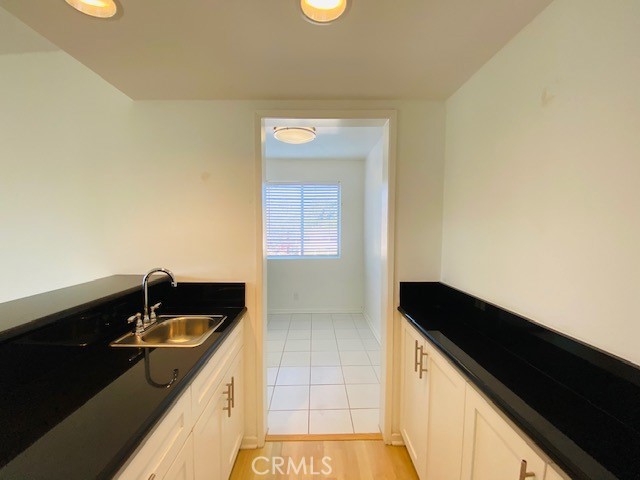 811 6th Street, Unit 305 Santa Monica, CA 90403 - Photo 15 of 25 a kitchen with a sink and cabinets