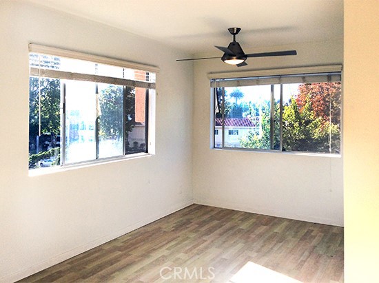 811 6th Street, Unit 305 Santa Monica, CA 90403 - Photo 16 of 25 a view of empty room with wooden floor and fan