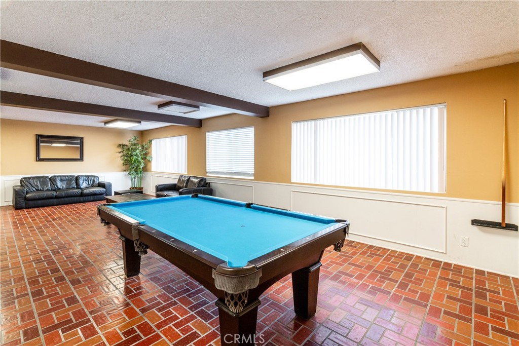 811 6th Street, Unit 305 Santa Monica, CA 90403 - Photo 22 of 25 a room with furniture pool table and windows