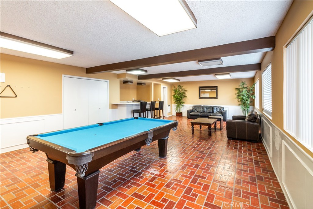 811 6th Street, Unit 305 Santa Monica, CA 90403 - Photo 23 of 25 a room with pool table and windows