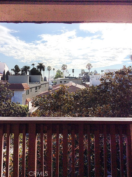 811 6th Street, Unit 305 Santa Monica, CA 90403 - Photo 10 of 25 a view of a balcony with wooden floor & fence