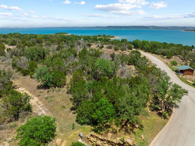 a view of a city with mountains in the background