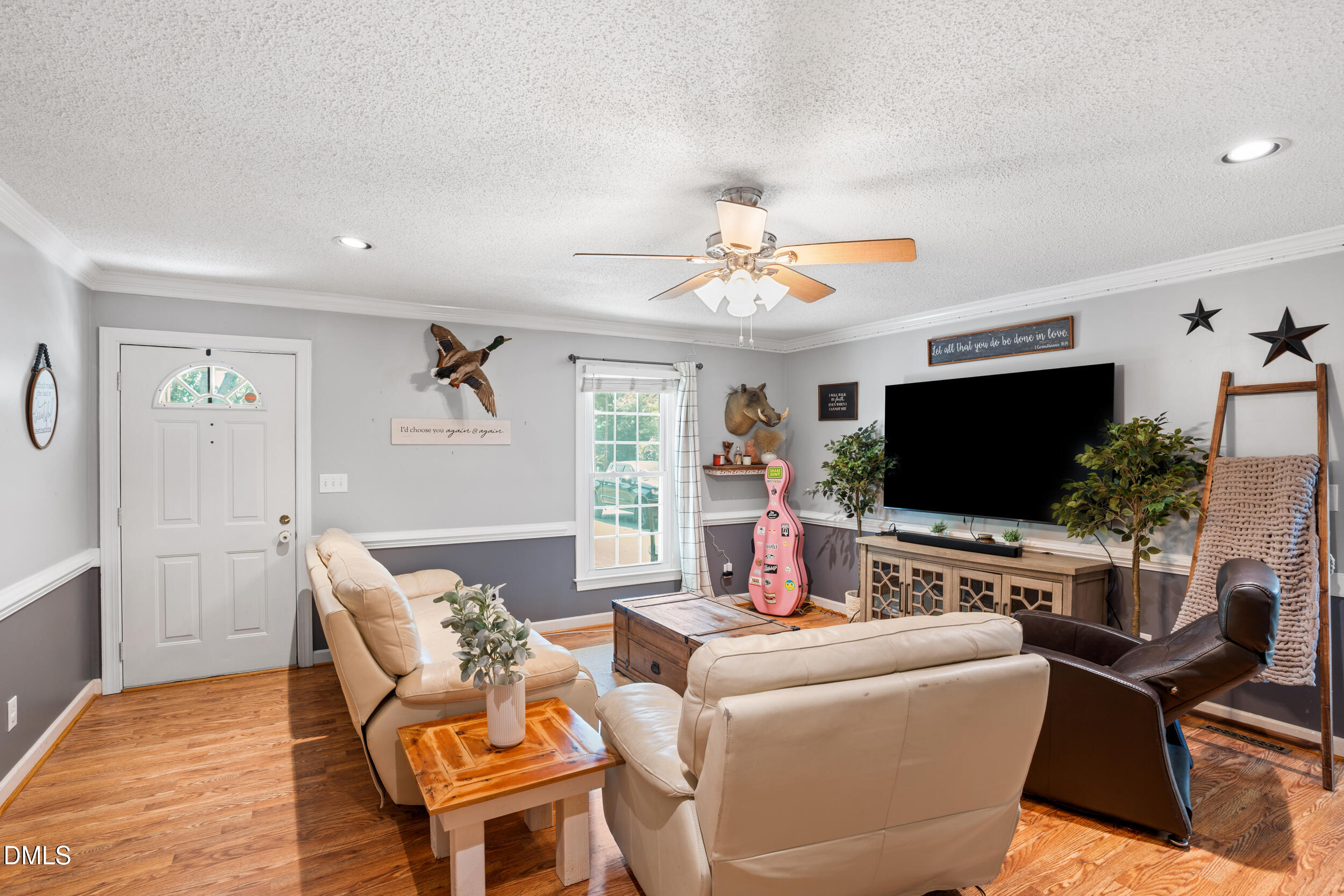 311 Bridgers Road Kenly, NC 27542 - Photo 14 of 46 a living room with furniture and a flat screen tv