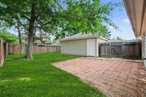 a house with tree in front of it