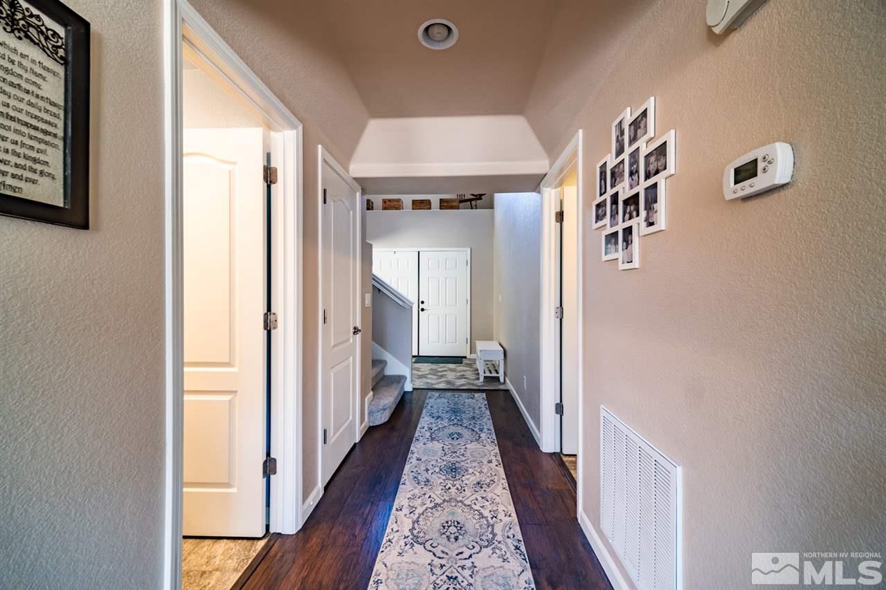 11398 Parma Court Reno, NV 89521 - Photo 12 of 39 a view of hallway with wooden floor