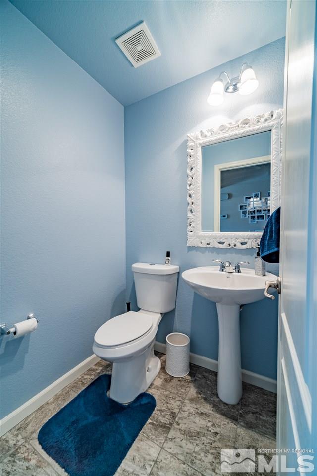 11398 Parma Court Reno, NV 89521 - Photo 14 of 39 a bathroom with a sink toilet and mirror