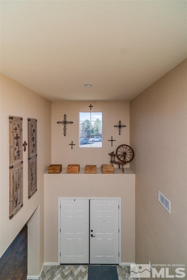 11398 Parma Court Reno, NV 89521 - Photo 17 of 39 a room with a sink and a mirror