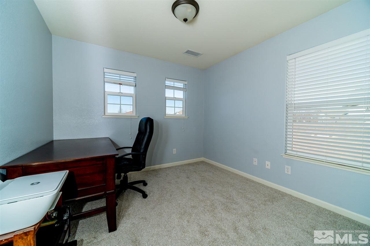 11398 Parma Court Reno, NV 89521 - Photo 20 of 39 a view of a workspace with furniture and a window