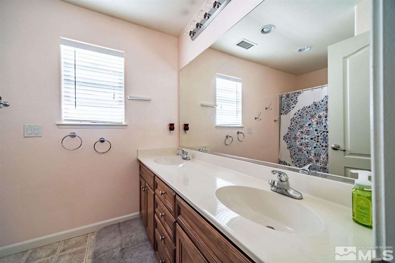 11398 Parma Court Reno, NV 89521 - Photo 21 of 39 a bathroom with a double vanity sink mirror and double