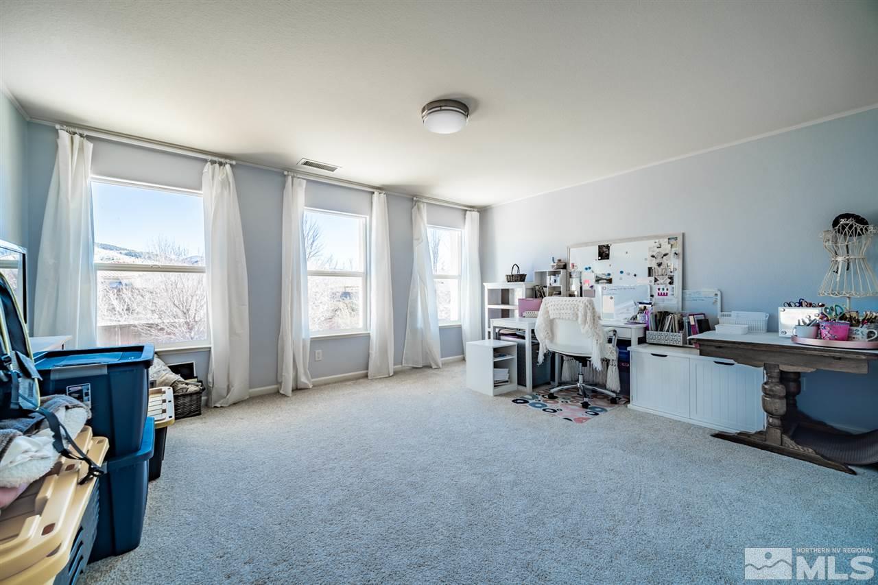 11398 Parma Court Reno, NV 89521 - Photo 24 of 39 a view of a workspace with furniture and a window
