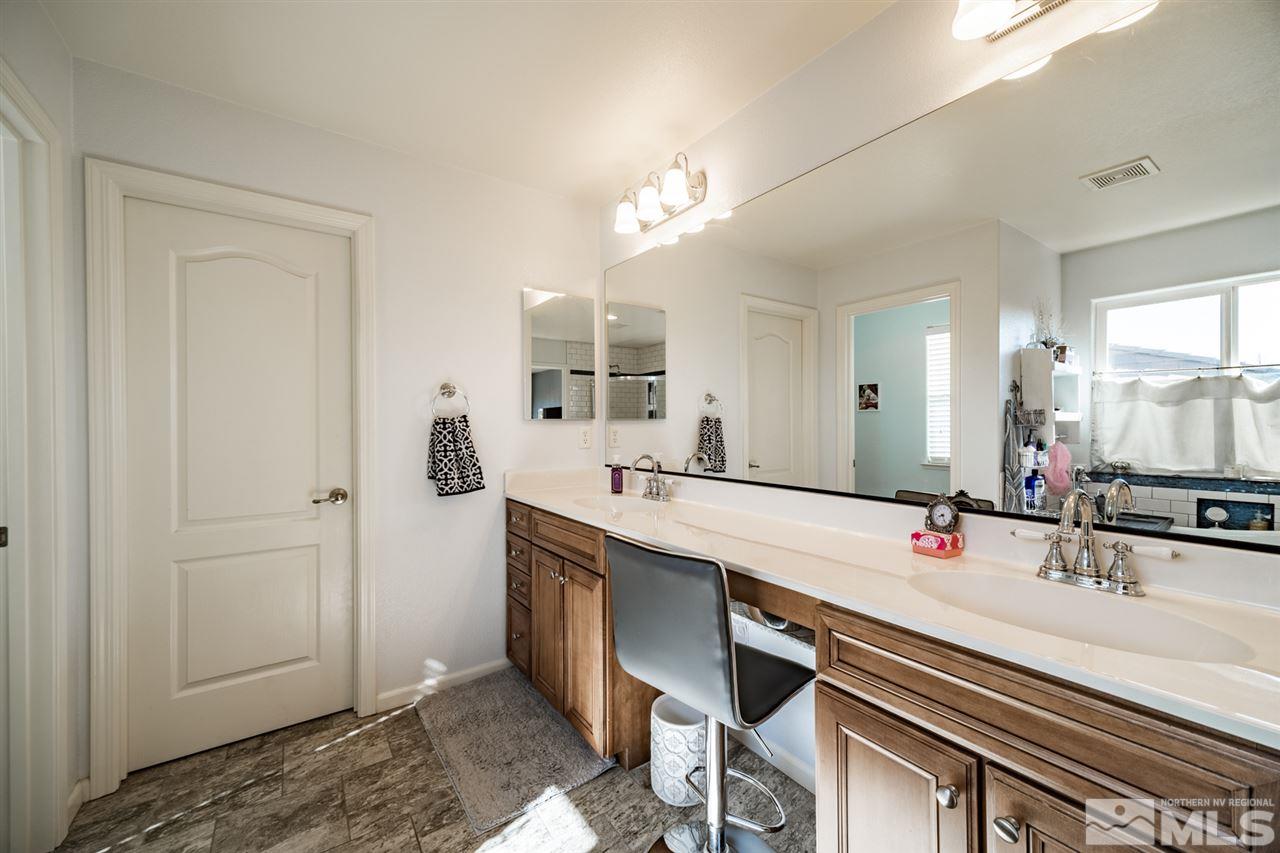 11398 Parma Court Reno, NV 89521 - Photo 27 of 39 a bathroom with a sink and a mirror