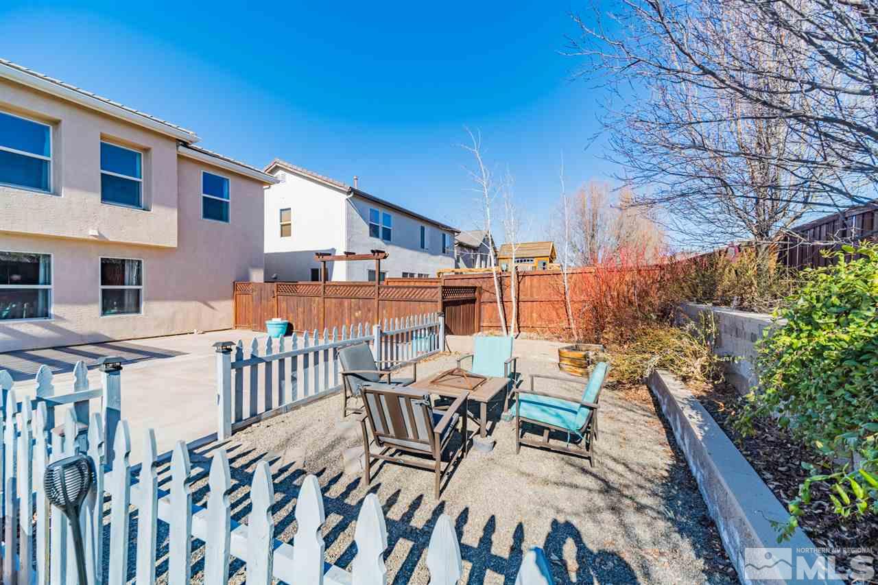 11398 Parma Court Reno, NV 89521 - Photo 33 of 39 a view of a patio with a table and chairs