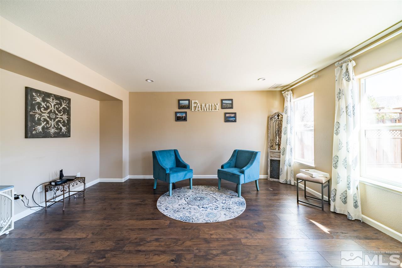 11398 Parma Court Reno, NV 89521 - Photo 7 of 39 a living room with furniture and a window
