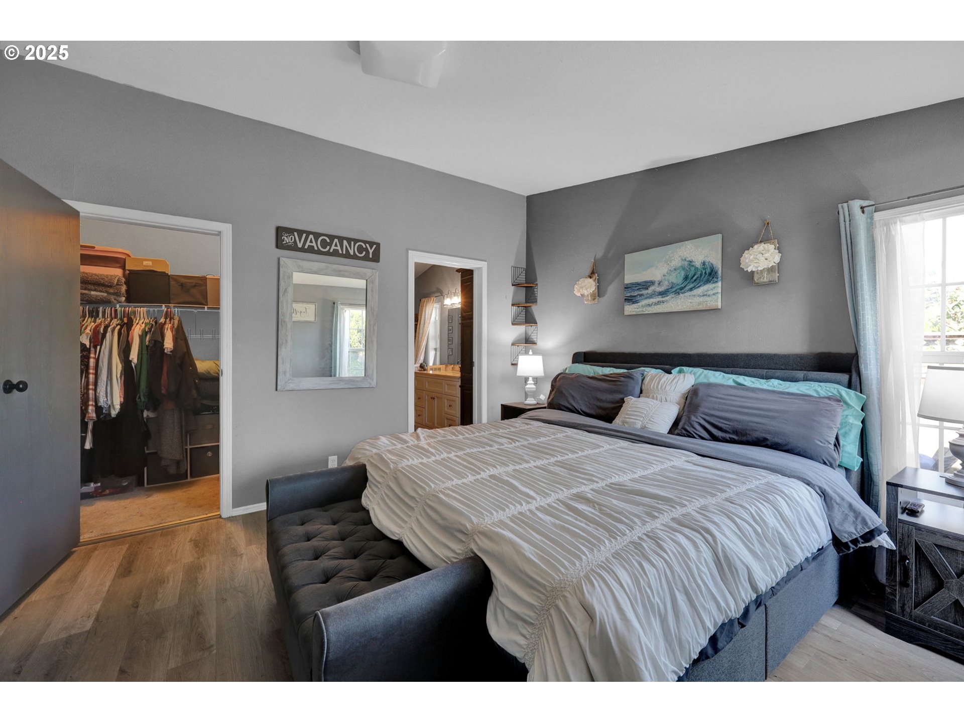 1320 T Street Springfield, OR 97477 - Photo 17 of 34 a bedroom with a bed and a painting on the wall