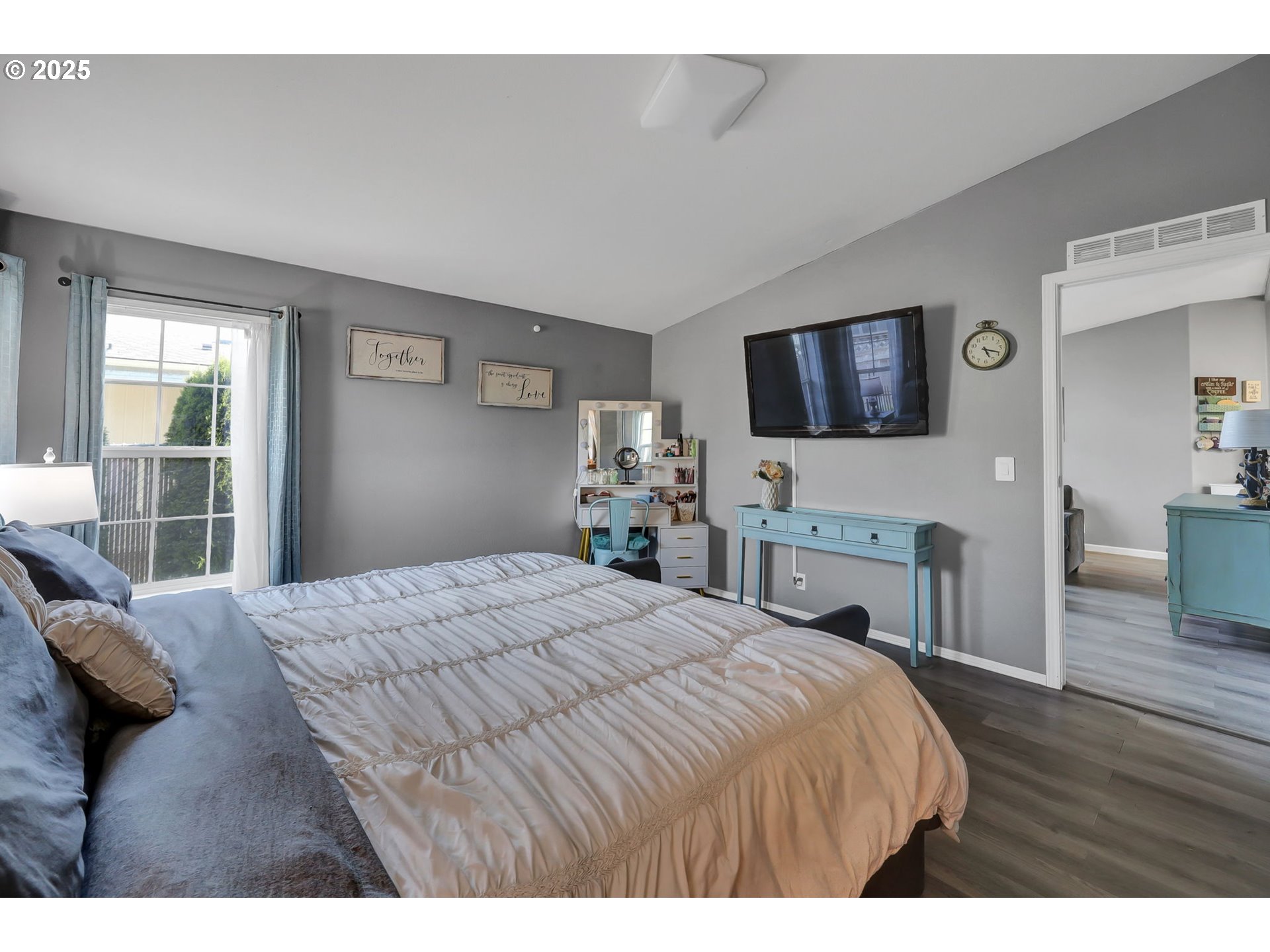 1320 T Street Springfield, OR 97477 - Photo 18 of 34 a bedroom with a bed and a flat screen tv