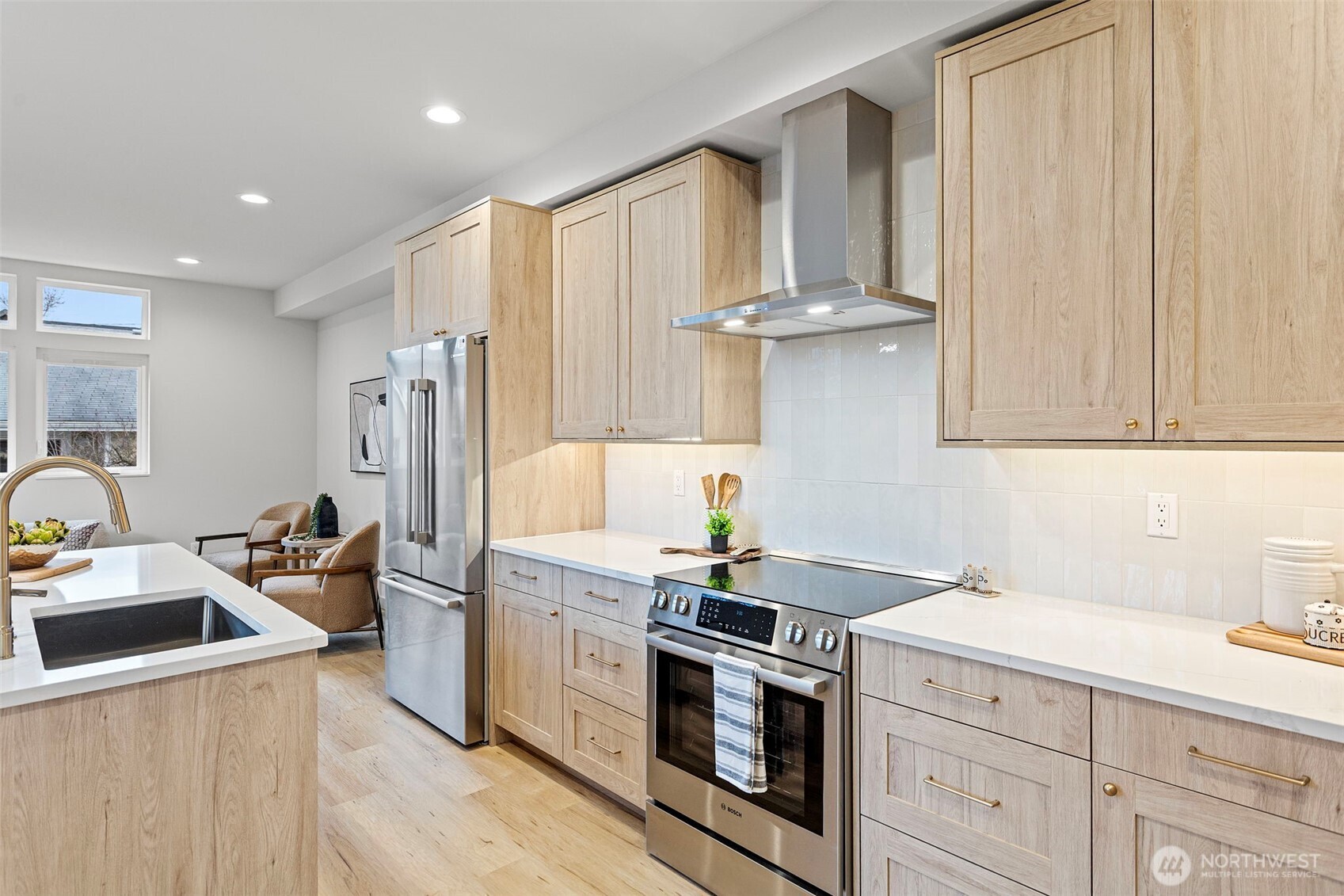 926 Northwest 57th Street, Unit B Seattle, WA 98107 - Photo 21 of 37 a kitchen with stainless steel appliances a sink stove and refrigerator